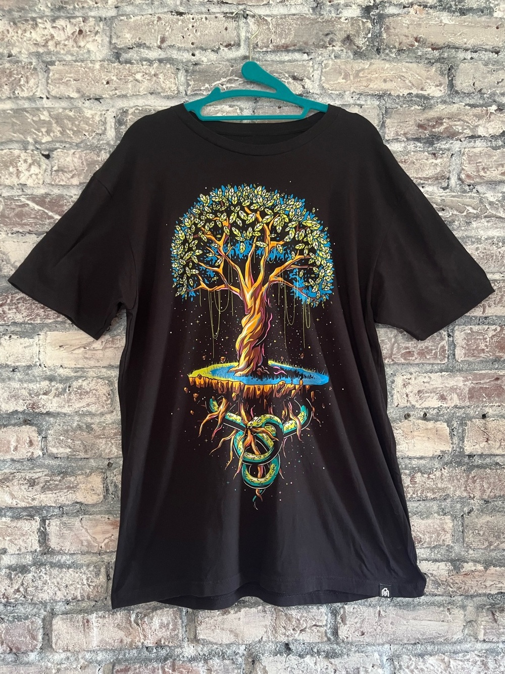 INTO THE AM  Black Tee with Vibrant Floating Tree inexcellent like new condition